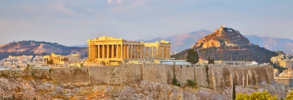 Akropolis i Aten, Grekland, med Parthenontemplet och en bakgrund av solnedgång.